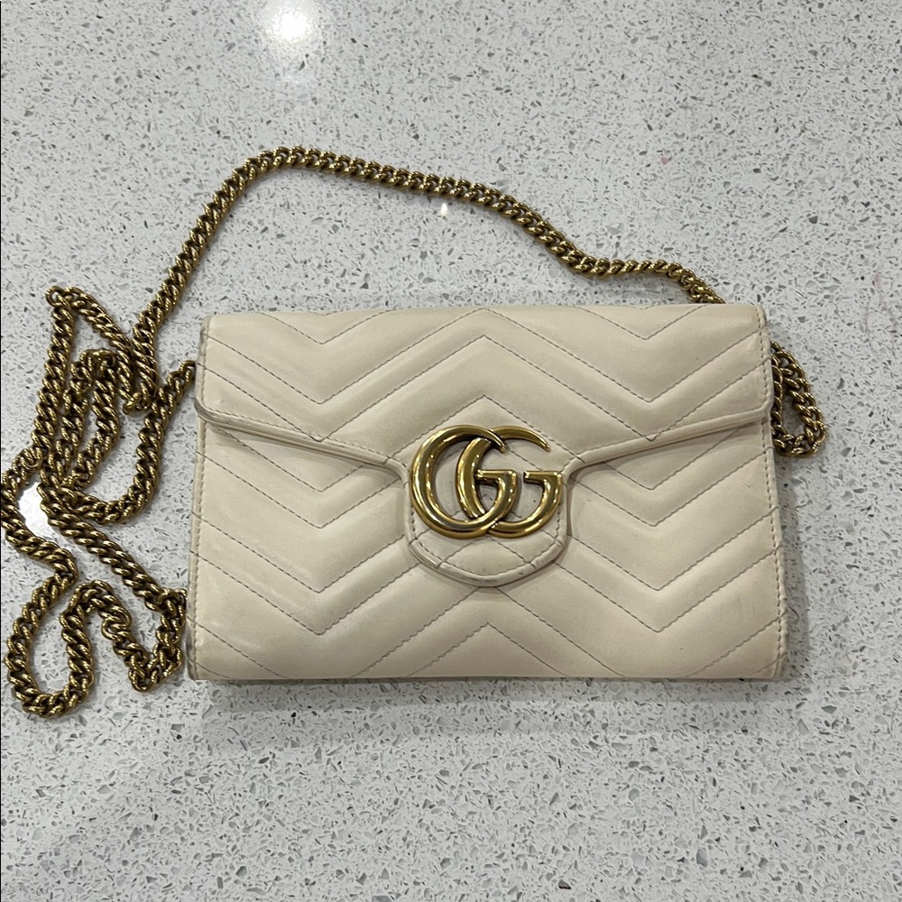 Gucci off-white Quilted Clutch with Gold Accents